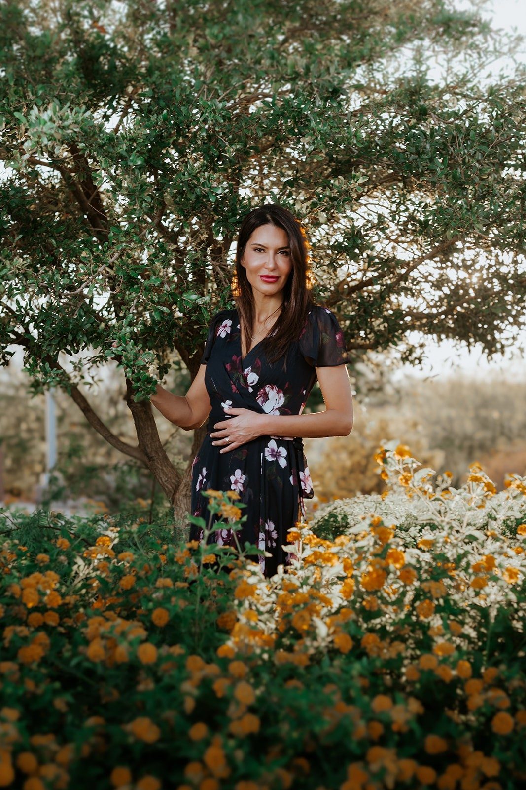 Serena Du Roch, in a cultivated garden at golden hour